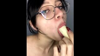 Girl with glasses gives a banana a blowjob...omg, looks like he got lucky