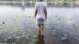 Tender girl. Nymph walks in a wet transparent shirt