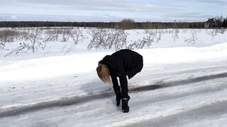 The girl is trying to walk on ice in ballet boots, but her toes are very painful